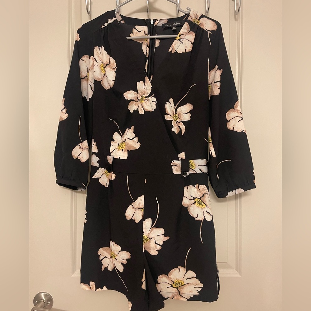 Black and floral romper with pockets from a boutique